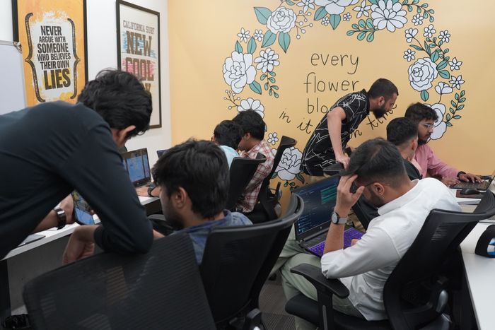 Alliance Corporation developers working together at their office