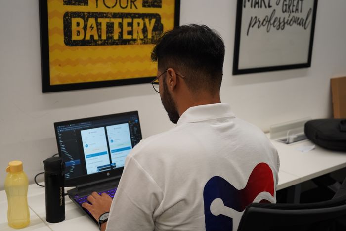 An Alliance Corporation engineer working across dual monitors