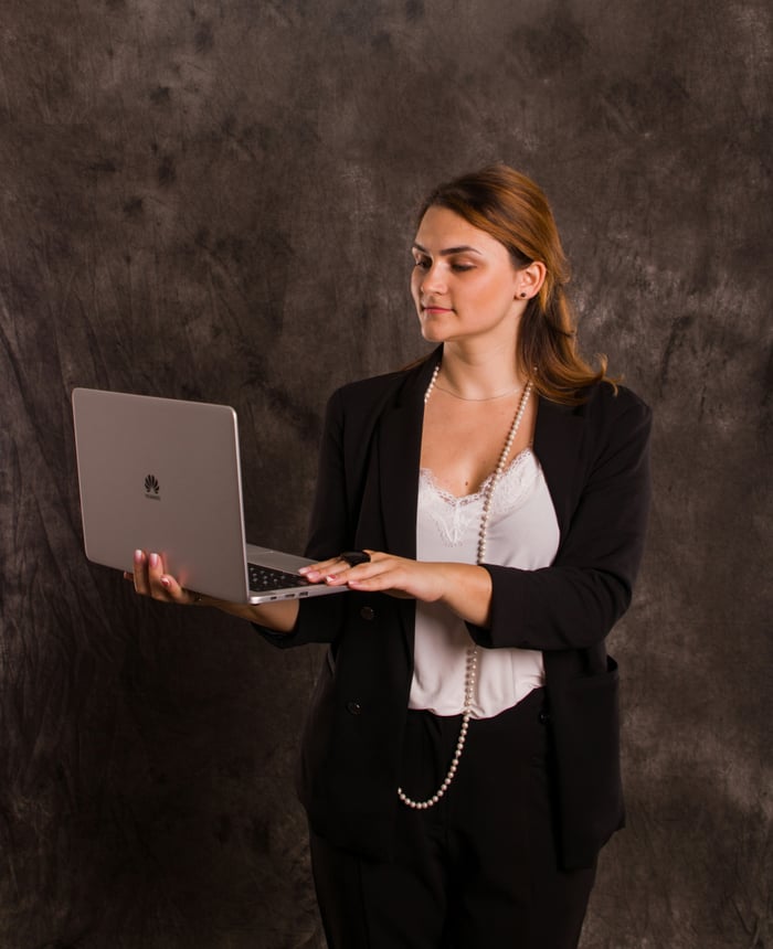 Alliance Corporation consultant reviewing a client system on a laptop