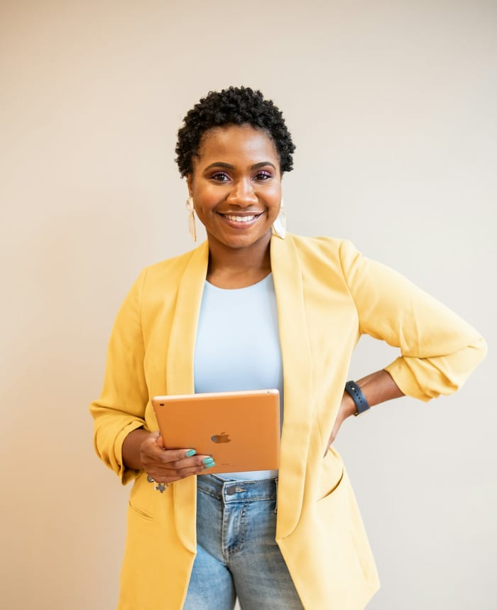 Consultant holding a tablet, ready to talk through a project