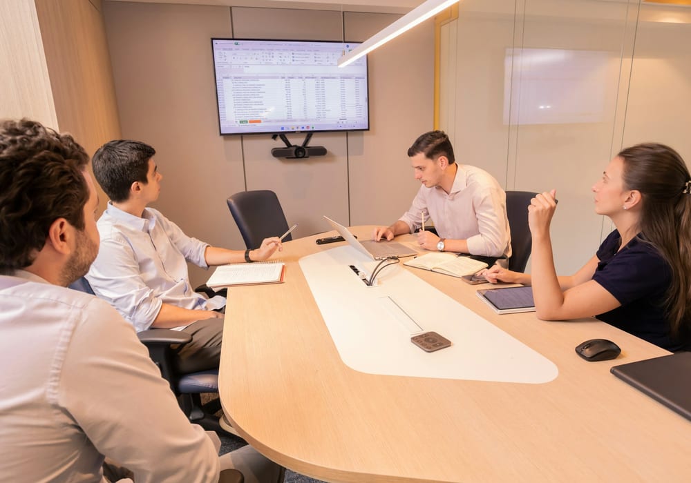 Project team in a boardroom working through a delivery review